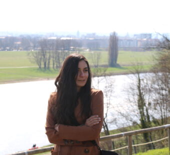 Our teacher Caro standing by a river
