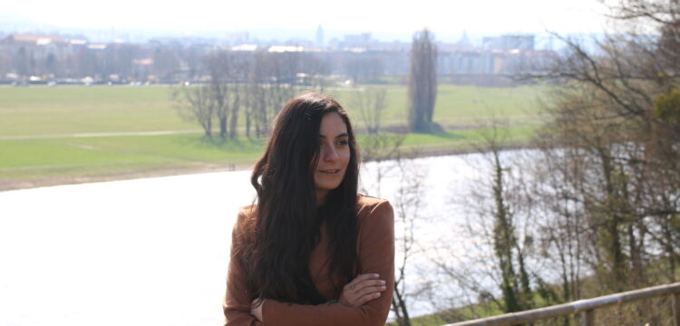 Our teacher Caro standing by a river