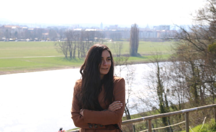 Our teacher Caro standing by a river